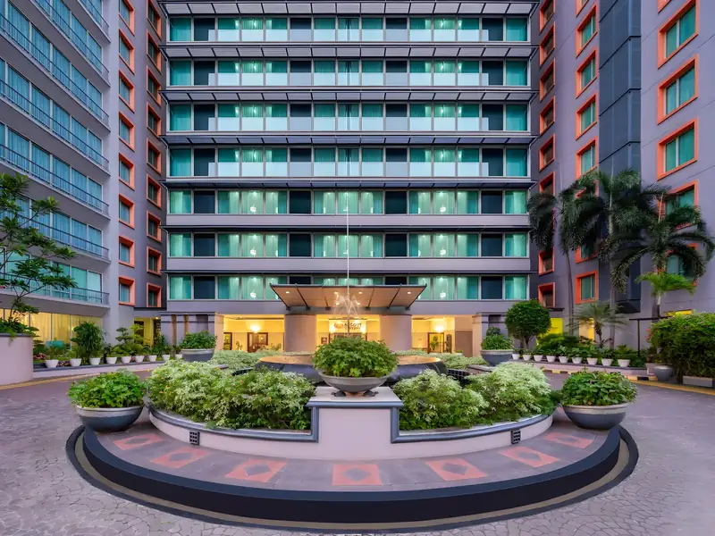 Ascott, Jakarta. Facade, glazing, porte-cochère and forecourt.